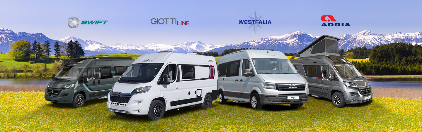 Four campervans each representing a large brand name in the campervan industry on a field - Block Image