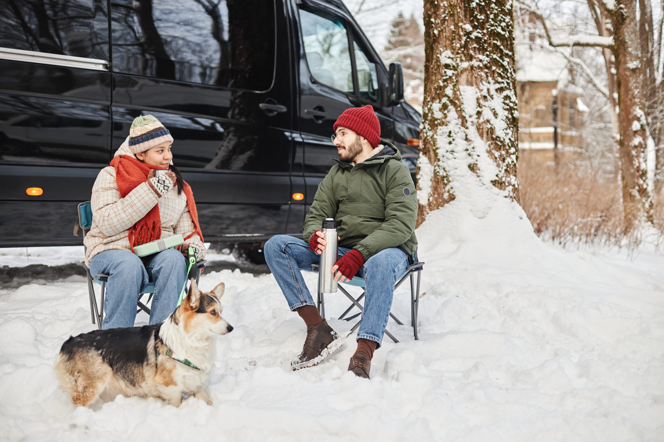 Couple Sat Outside Campervan Scaled